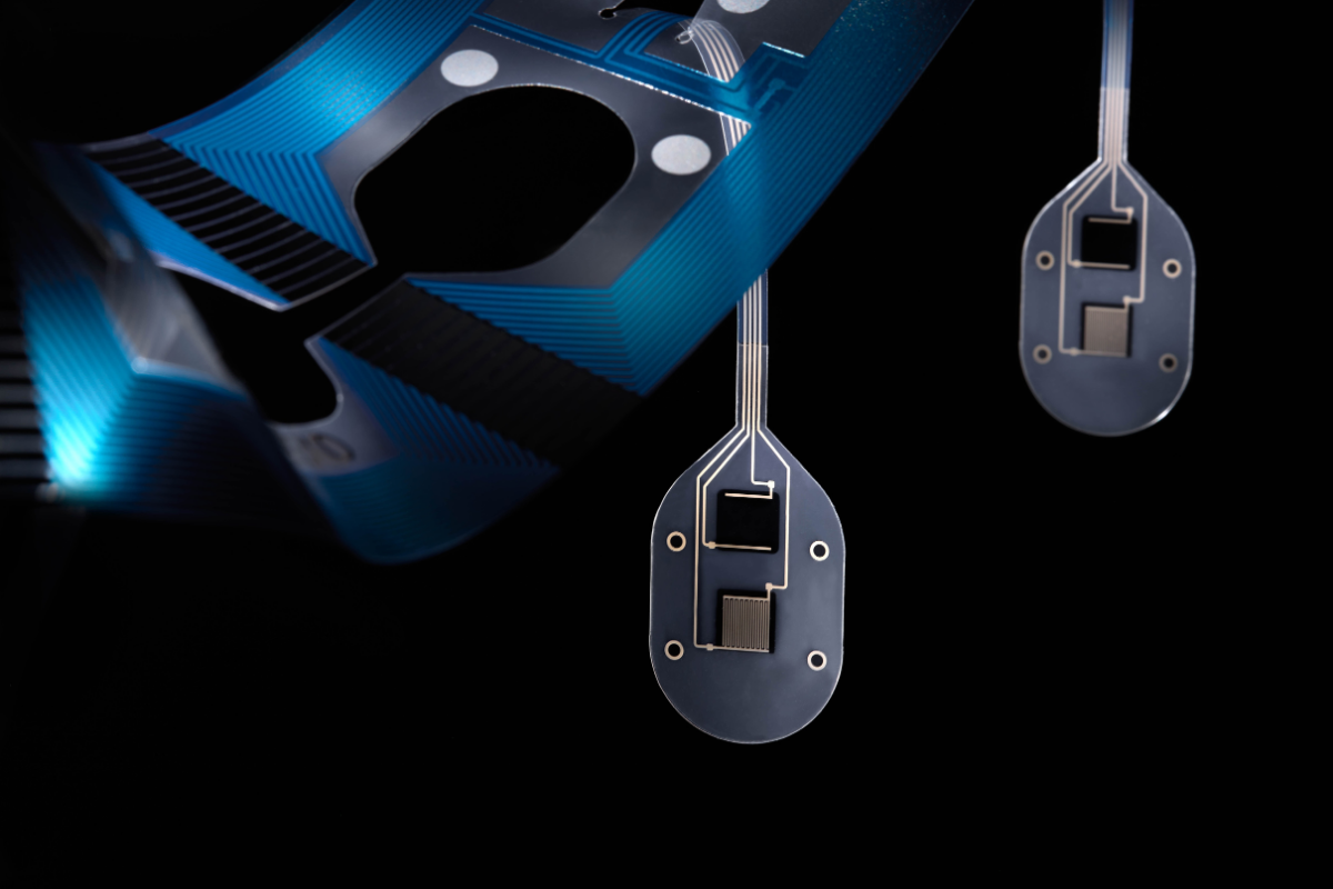 foil with printed electronics with cut outs and sensor flaps